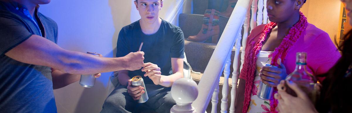 Young teenage boy gets offered cannabis joint at a house party.