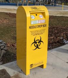 Yellow Needle Drop Box on the sidewalk